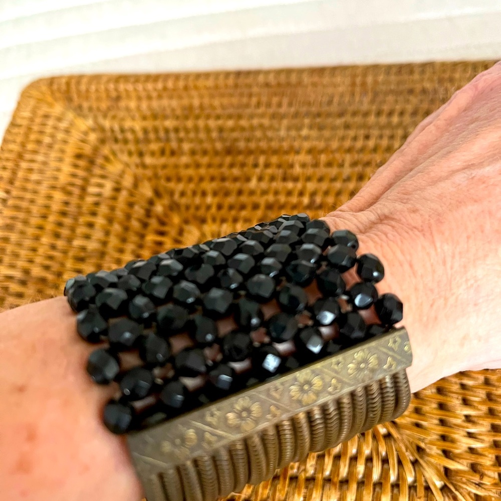 Brass metal and black crystals bracelet. Very wide _ almost 3.5 inches wide.